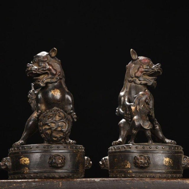 This distinguished pair of antique gilt bronze guardian lions adds a stately, historical presence to any interior. Each...