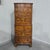 Excellent honey coloured small sized bowed Queen Anne style chest on chest of six drawers with brass handles, standing on...