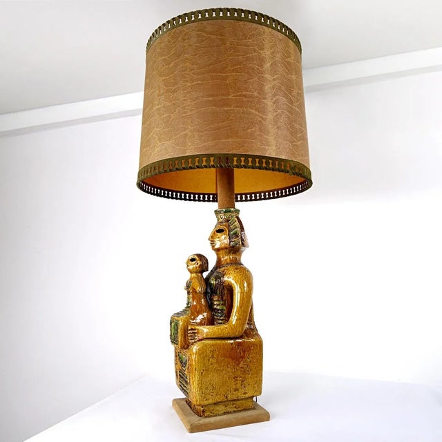 This eye catching floor or table lamp in Mayan style truly is an impressive piece. Its foot is a large ceramic statue of a...