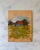 Oil and wood panel painting depicting a weathered barn structure in a wide grassy field by Austin-based landscape artist...