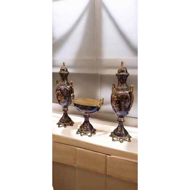 Elevate your home decor with this luxurious 3-piece French-style porcelain urn and centerpiece set. Designed to evoke the...