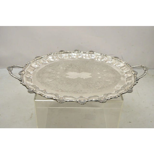 Large Vintage Edward San Giovanni Silver Plated Shell Form Twin Handle Platter Tray. Item featured is a large impressive...