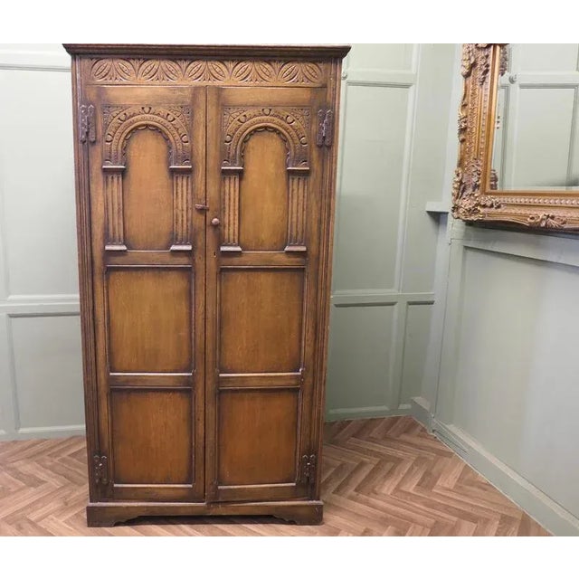 Arts and Crafts Hall Wardrobe in Oak This is a good Style Arts and Crafts piece, it has a full length hanging rail and a...