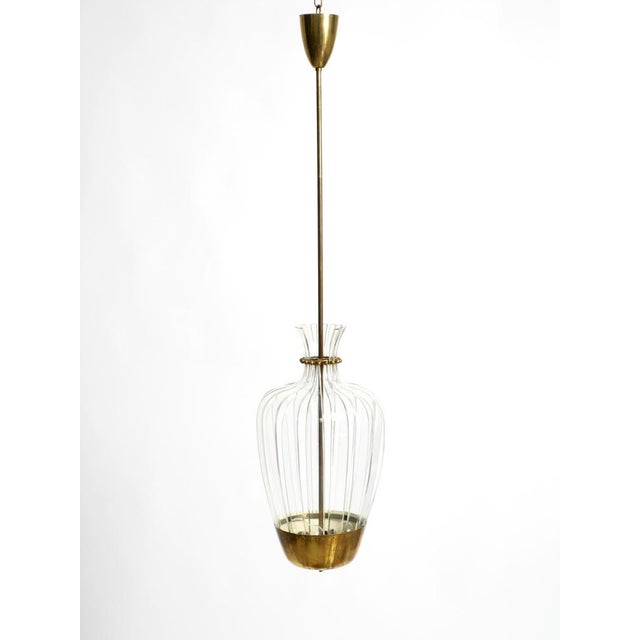 Exceptional, unique, and large original mid-century modern pendant lamp. manufacturer: vereinigte werkstätten. Made in...