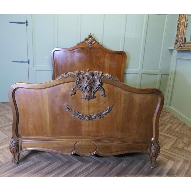 Louis XV Style French Golden Walnut Bed The bed has a superbly carved crest on the Footboard and a smaller matching one on...
