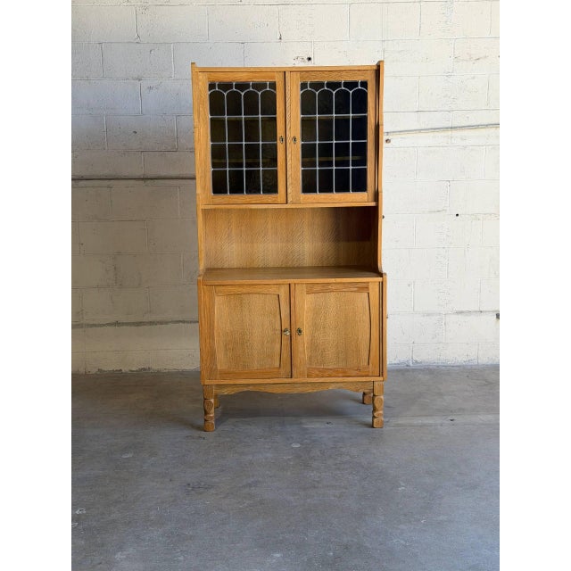 Beautiful vintage Danish oak hutch cabinet in style of Henning Kjærnulf, featuring elegant Scandinavian craftsmanship and...