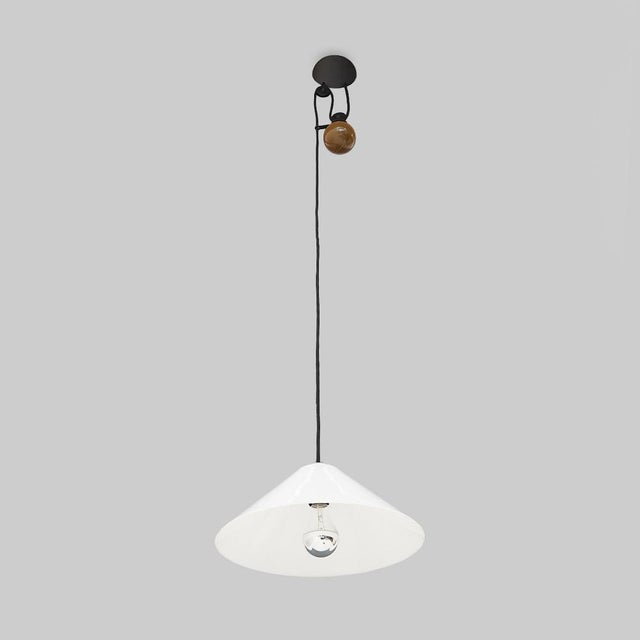 Italian-made up and down chandelier produced by Artemide in the 1970s based on a design by Enzo Mari. Wall support in...