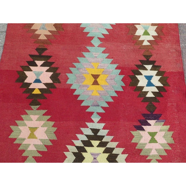 This beautiful, traditional vintage, flatweaved Turkish kilim is approximately 60 years old. It is handmade of very fine...