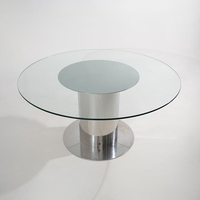 A “Cidonio” table designed by Antonia Astori for Driade in the 1970s, characterised by a large circular transparent glass...