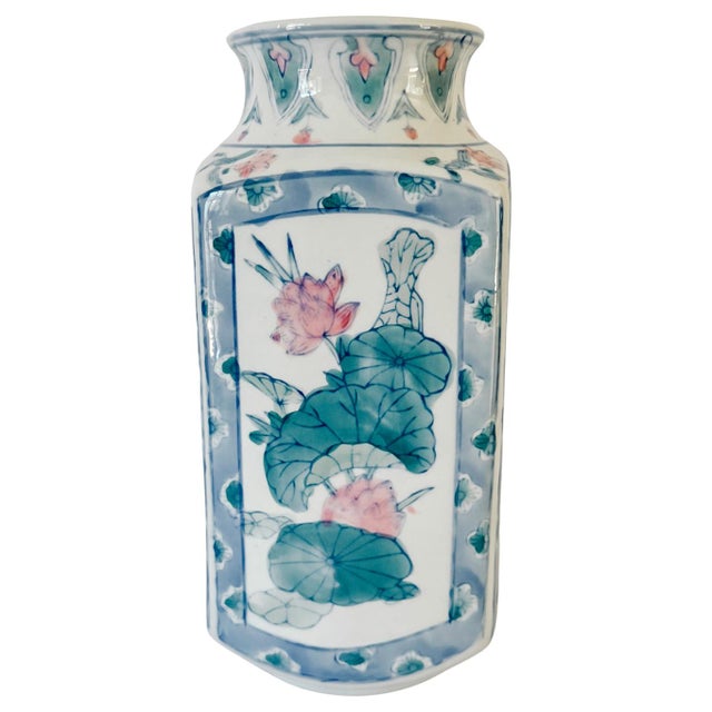 A serene vintage Japanese square porcelain vase crafted in a flared baluster silhouette with four flat panels and gently...
