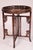 Chinese rosewood round side table, circa 1920's. With a carved and reticulated gallery, resting a folding stand with...