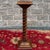 A vintage Jacobean Revival plant stand or pedestal having a square crown molding top and base with barley twist column...
