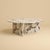 Calacatta Viola marble gives the Ishiki its register. This is a low table for the space in front of a sofa, built so that...