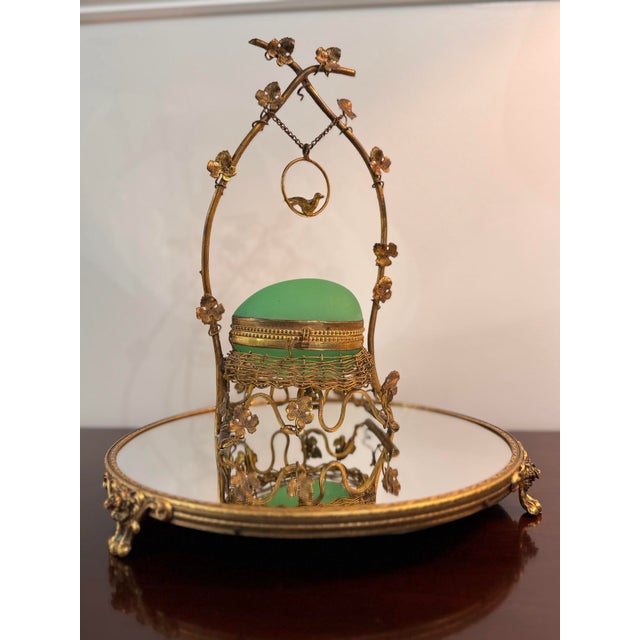 An exceptional and highly decorative antique French egg-form casket in vibrant uranium opaline glass, presented within an...