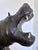 This large leather hippopotamus statue is a handcrafted piece with detailed workmanship. It features a naturalistic form...