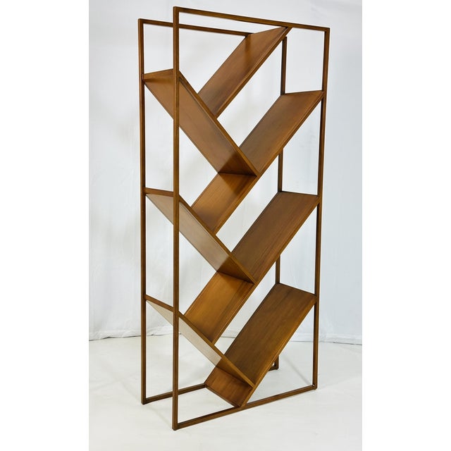 Geometric étagère and open display bookcase, distinguished by its architectural silhouette, sculptural framework, and...
