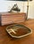 Handcrafted studio pottery wall plate dated 1991, featuring an expressive abstract resist-glaze design in warm iron brown...