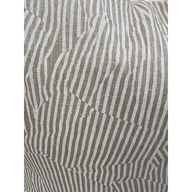 Chic designer pillow covered in Kelly Wearstler Avant fabric. The fabric features a tan and white subtle abstract animal...