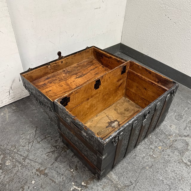 Design Plus Gallery presents a 19th Century Dome Top Steamer Trunk. This antique trunk showcases a rounded lid with...