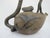 Handmade Chinese Yixing Zisha clay teapot, uniquely sculpted to resemble gnarled textured tree branches, mimicking a peach...