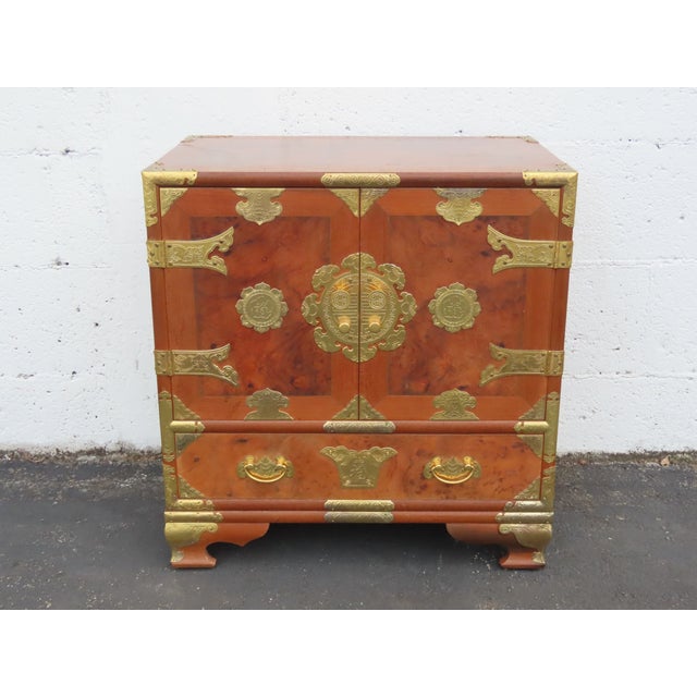 Beautiful vintage Asian-inspired nightstand/end table crafted from wood, burlwood, veneer, and metal. This distinctive...