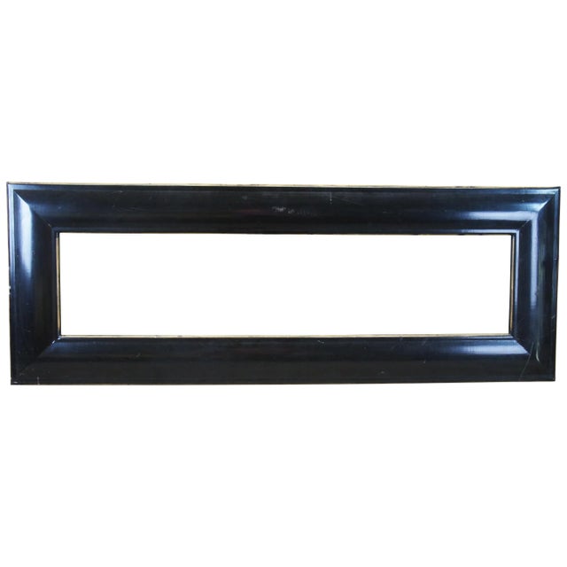 Monumental art or mirror frame featuring thick convex wooden panels painted black with gold accents. Very heavy. 31.5" x 1...