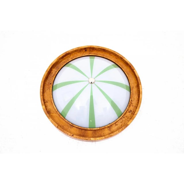 Art Deco ceiling lamp from the mid-20th century, Poland. Ceiling lamp on a wooden base with a geometric form...