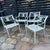 Pair of white vintage Molla Metal Garden Dolphin Chairs, cast iron with neoclassical detailing on back and seat. Fresh...