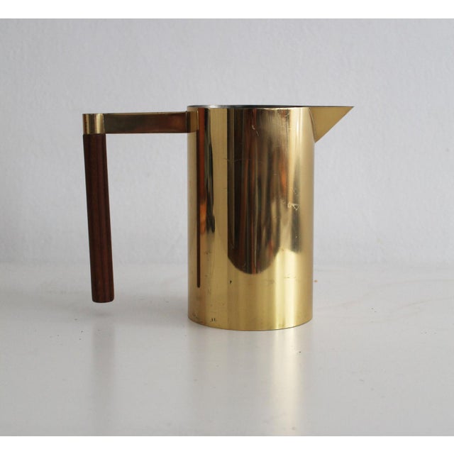 This is a water jug made in the 1970's by Perk company in Switzerland. The jug is made entirely of copper, only the handle...