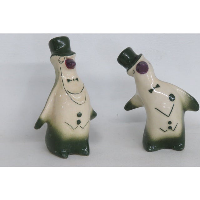 This darling pair of novelty Salt and Pepper Shakers is made out of ceramic with a glossy finish. These adorable penguin...