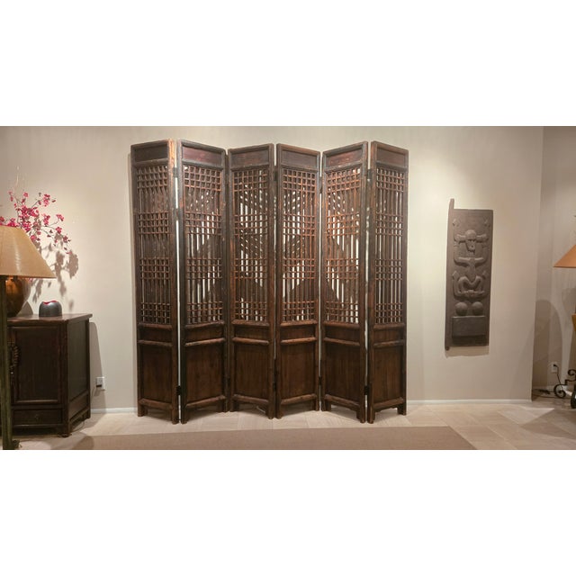 Six individual panels that lock together with stunning lattice work. Wood has naturally patinaed paint that add to depth...
