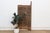 Look at this door long enough and it starts to read like a diagram: two guardian figures with their arms thrown open,...