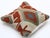 A one-of-a-kind handwoven Afghan wool kilim accent pillow featuring large hooked diamond in red and cream with blue...