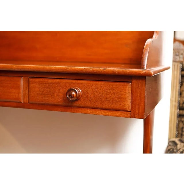 Mahogany Three-Drawer Antique English Wash Stand With Back Splash And Stretcher.