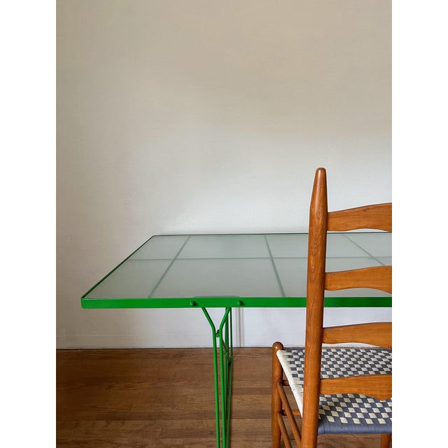 Vintage “Moment” dining table designed by Neil’s Gammelgaard and produced by IKEA. Frosted glass top and steel gridded...
