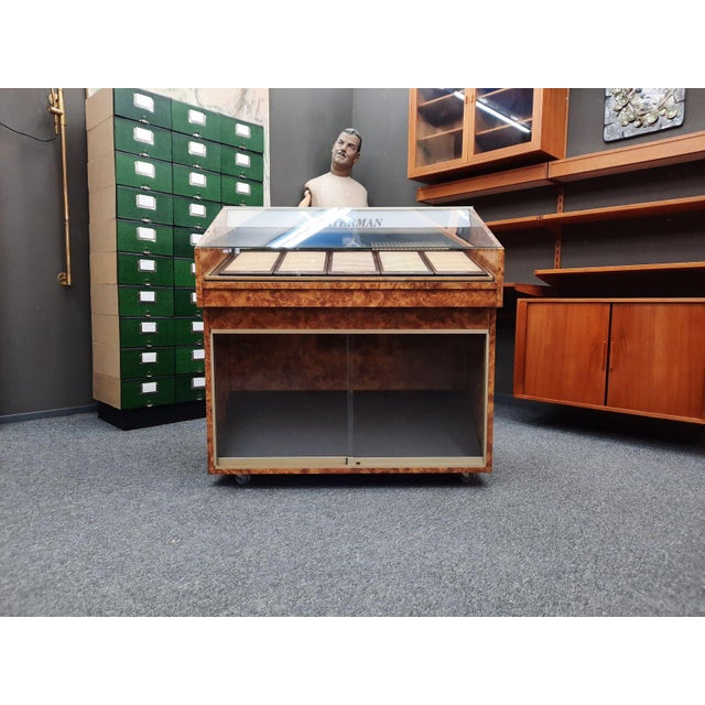 A charming glass-fronted display case with lighting. It was used to display Waterman ballpoint pens and fountain pens. It...