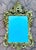This decorative wall mirror is crafted in molded plaster and finished with a gilt surface, designed in the Baroque style....