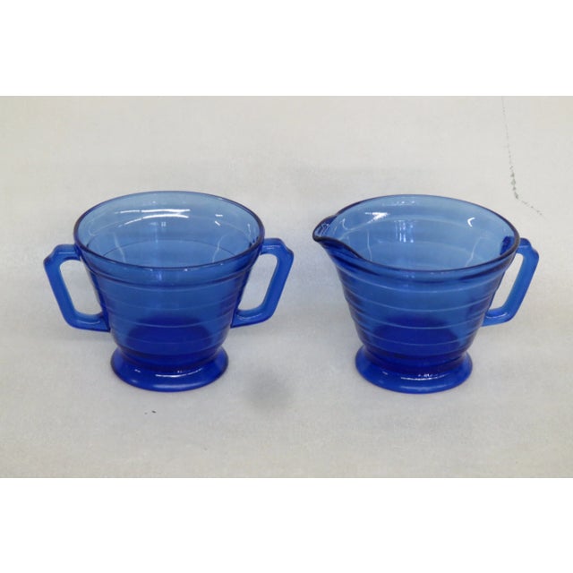 This magnificent Creamer and Sugar bowl set is made of glass. We believe the set made by Hazel Atlas due to its style,...