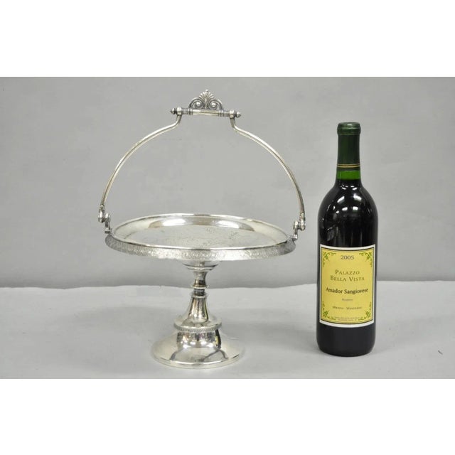 Antique Reed & Barton Victorian Silver Plated Pedestal Brides Basket w/ Handle. Circa Early 20th Century. Measurements:...
