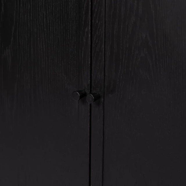 Classic and versatile, an ebony-finished oak bookcase features open shelving plus lower cabinetry for plenty of storage...