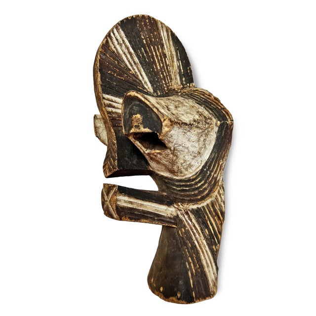 Vintage carved wood kifwebe mask from the Songye people of Democratic Republic of Congo. Exceptional stylized sculptural...