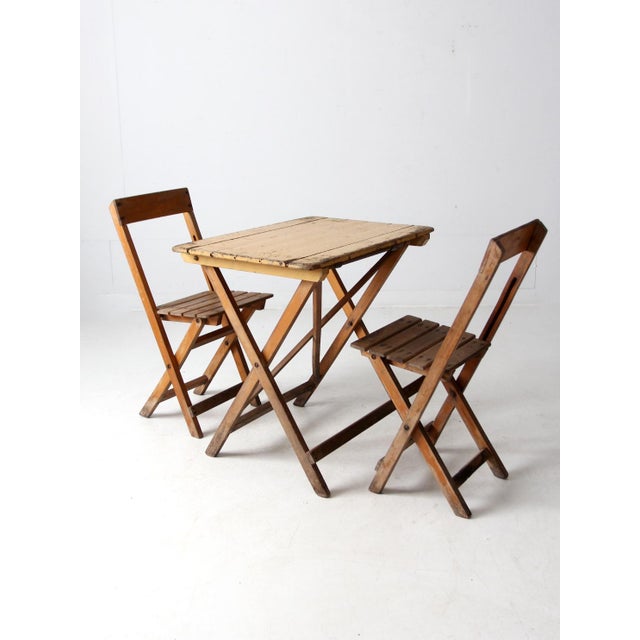 This vintage folding table and chair set was made by Van Stokkum of Vlijmen, Netherlands, likely in the 1930s to 1950s....