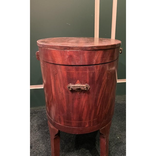 A Toast to Timeless Elegance Step into the refined world of Regency-era England with this exquisite Georgian cellarette, a...