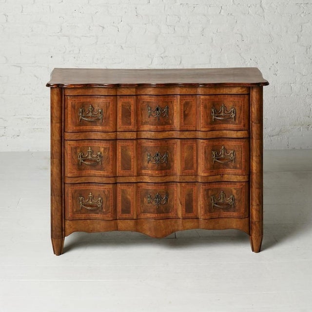 This 19th Century French Regency style commode showcases bold architectural lines and richly grained oak construction,...
