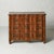 This 19th Century French Regency style commode showcases bold architectural lines and richly grained oak construction,...