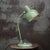 Green French Manufrance Bauhaus style metal desk lamp ca 1950 Diameter base 17 cm Black cotton wire with plug. Available...
