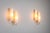 This pair of double-shaded sconces combines refined elegance with warm, atmospheric lighting. Each fixture features two...