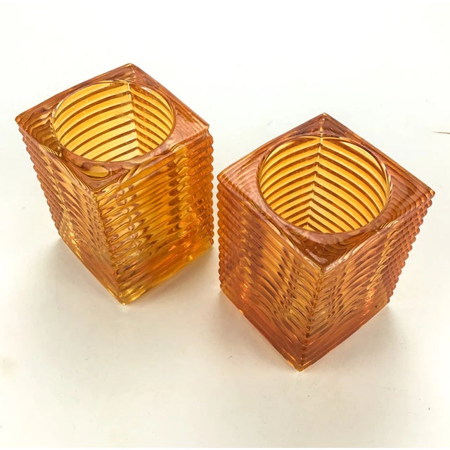 Bring a warm feel to any table or room with these 2 Hollowick Glass Candle Holders. Hollowick Amber Glass Horizontal Rib...