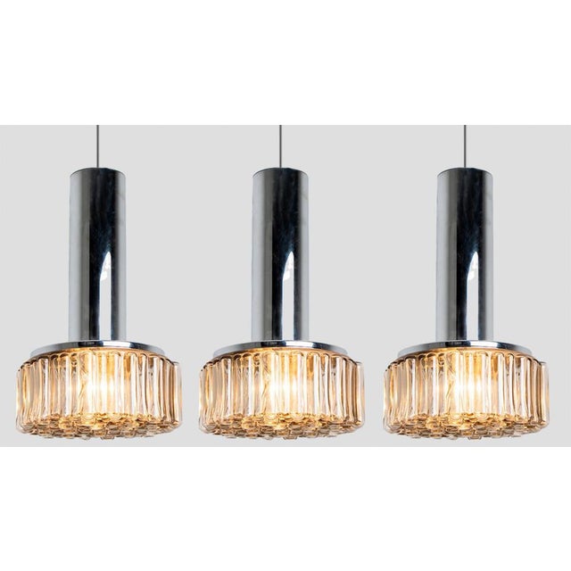 One of the three original 1970s pendant lights produced by Staff Leuchten, Germany. Heavy quality glass lights with bubble...