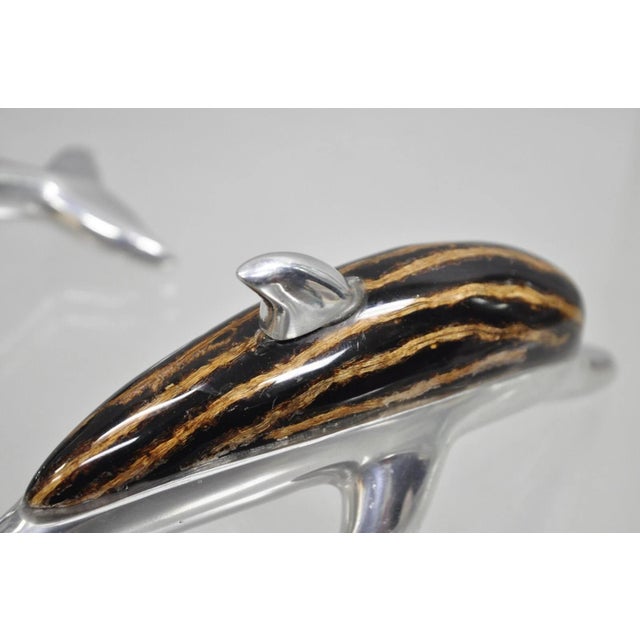 Atlantis Paradise Island Bahamas Metal & Faux Tortoiseshell 8" Dolphin Sculpture - (Pair). Circa Late 20th Century....